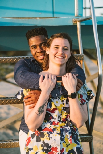 engagement session coronado lifeguard tower island sunset san diego california white girl yellow blue red dress african american interracial couple dusk